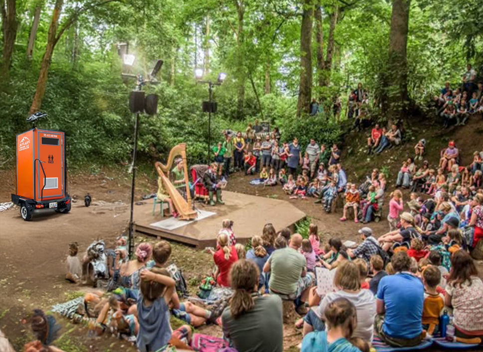 Interior of a luxury portable restroom trailer with a modern vanity, mirror, and flush toilet for VIP events in New Zealand.