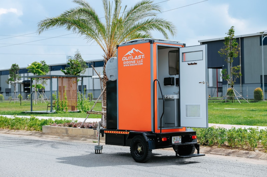 Motion-activated LED lighting system inside an energy-efficient portable restroom.
